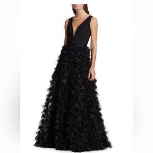 Marchesa's sleeveless gown with a pleated bodice and appliqué detail at skirt.